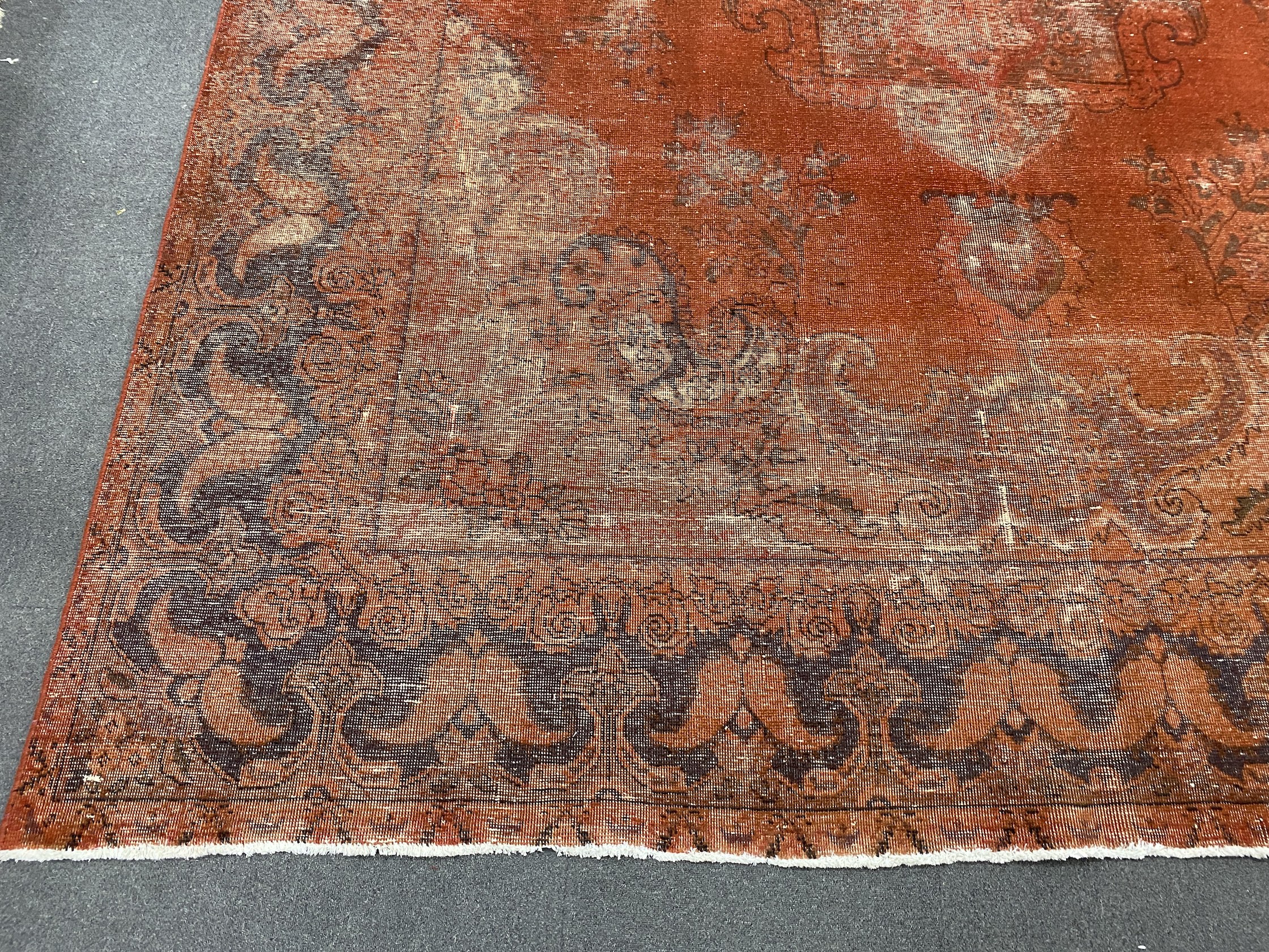 A red ground carpet, 360 x 298cm